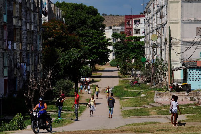 FILE PHOTO: People walk on a street, in Santiago