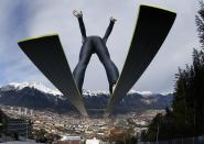 Austria's Gregor Schlierenzauer takes off from the ski jump during the first practice session of the third jumping of the four-hills tournament in Innsbruck, in this January 3, 2014 file photo. REUTERS/Kai Pfaffenbach/Files (AUSTRIA - Tags: SPORT SKIING TPX IMAGES OF THE DAY)