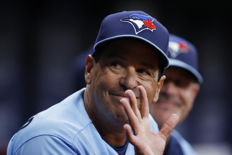 Toronto Blue Jays manager Charlie Montoyo waves to people in the stands during the first inning of the team's baseball game against the Tampa Bay Rays on Friday, May 13, 2022, in St. Petersburg, Fla. (AP Photo/Scott Audette)