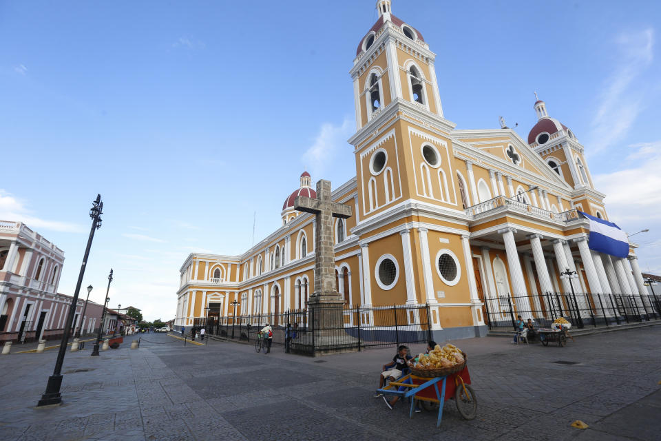 The colonial downtown of the city of Granada and its cathedral looks forlorn and empty for lack of tourists, in Nicaragua, Monday, Sept. 10, 2018. Nicaragua's economy has been devastated by the nearly five months of unrest sparked by cuts to social security benefits that quickly evolved into calls for President Daniel Ortega to step down. (AP Photo/Alfredo Zuniga)