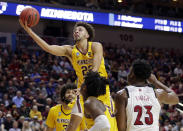 <p>Minnesota’s Gabe Kalscheur (22) goes for a layup as Louisville’s Steven Enoch (23) watches, during the second half of a first round men’s college basketball game in the NCAA Tournament, in Des Moines, Iowa, Thursday, March 21, 2019. (AP Photo/Nati Harnik) </p>