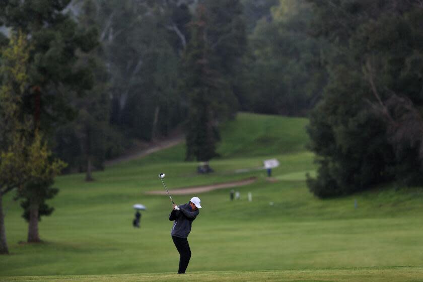 LOS ANGELES, CA-MARCH 19, 2020: Mario Kim plays a round at the Wilson & Harding Golf Course in Griffith Park on March 19, 2020 in Los Angeles, California. He wanted to play with his friend and said that the private course he belongs to is only allowing family members to help curb the spread of the coronavirus. (Photo By Dania Maxwell / Los Angeles Times)