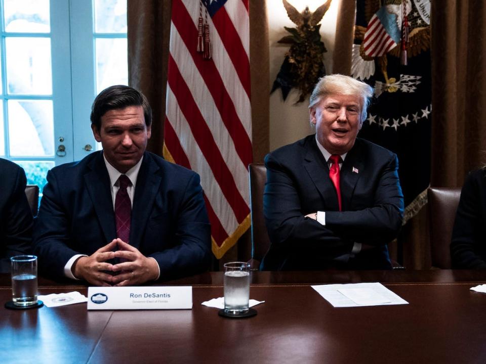 President Donald J. Trump, flanked by Florida Gov.-elect Ron DeSantis and South Dakota Gov.-elect Kristi Noem, speaks during a meeting with Governors-Elect in the Cabinet Room at White House on Thursday, December 13, 2018 in Washington, DC.