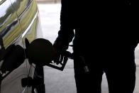 FILE PHOTO: Motorists wait in long lines to enter gasoline station during surge in demand for fuel in Durham, North Carolina