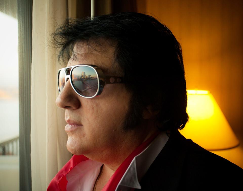 Jacksonville's Rick Marino began impersonating Elvis Presley 50 years ago — the same year Presley came to town for one of his Jacksonville concerts (April 16, 1972). In this 2010 photo, Marino looks out on the skyline of Jacksonville from the room in the Crowne Plaza Hotel (formerly the Hilton) where Elvis slept during his 1970s tour stops in Jacksonville.