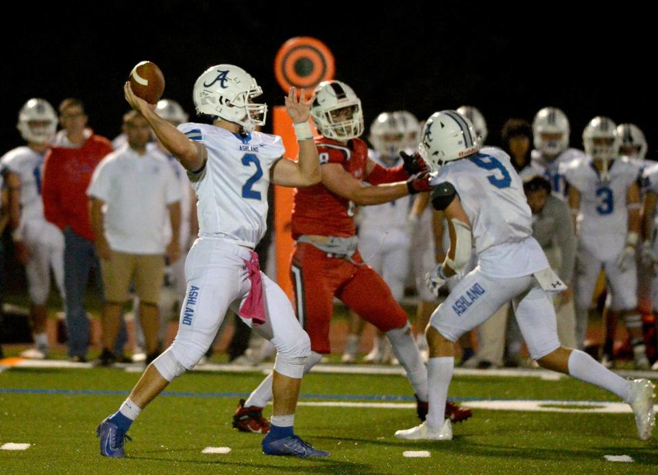 Ashland High School senior captain quarterback Luke Herter throws against Holliston, October 8, 2021.