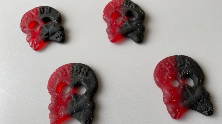 four red and black skulls