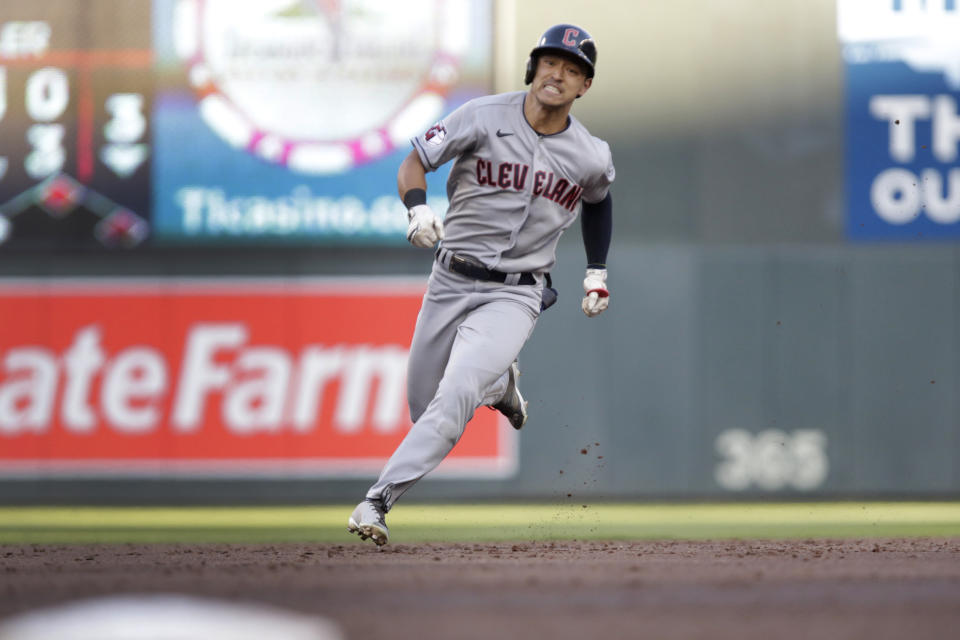 Cleveland Guardians' Steven Kwan runs to third base on an RBI triple against the Minnesota Twins during the third inning of a baseball game Wednesday, June 22, 2022, in Minneapolis. (AP Photo/Andy Clayton-King)