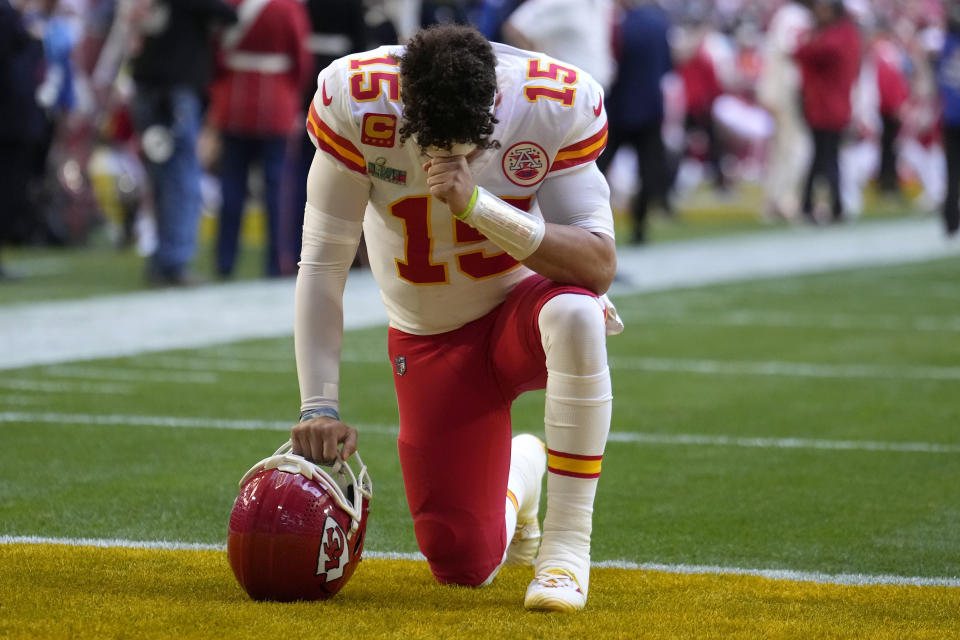 Kansas City Chiefs quarterback Patrick Mahomes (15) prays in the end zone before the NFL Super Bowl 57 football game between the Kansas City Chiefs and the Philadelphia Eagles, Sunday, Feb. 12, 2023, in Glendale, Ariz. (AP Photo/Marcio J. Sanchez)