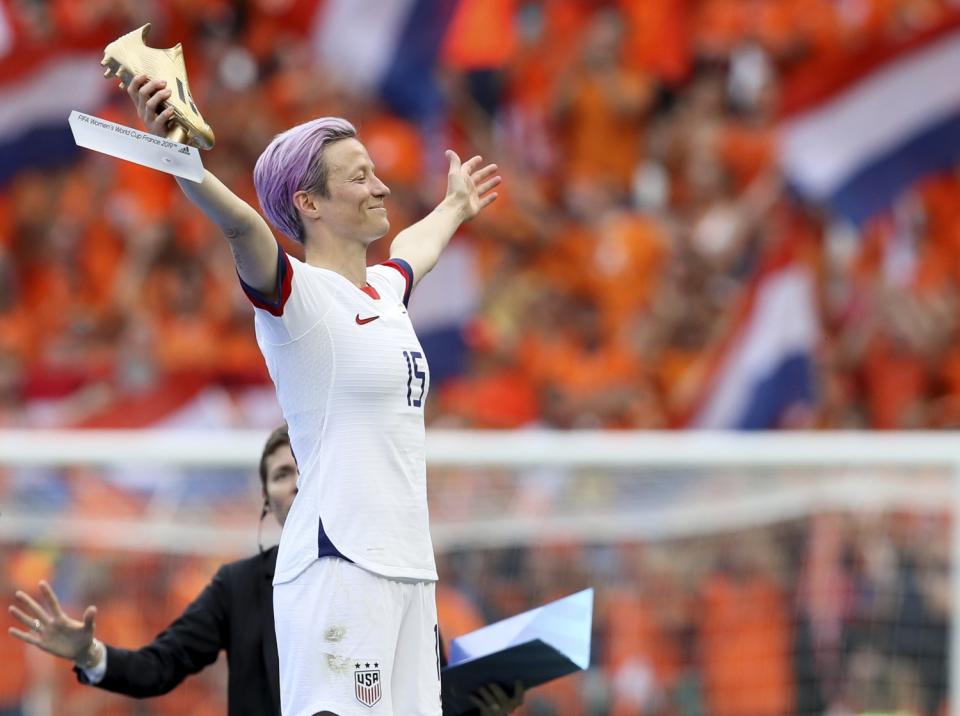 Megan Rapinoe celebrates on soccer field.