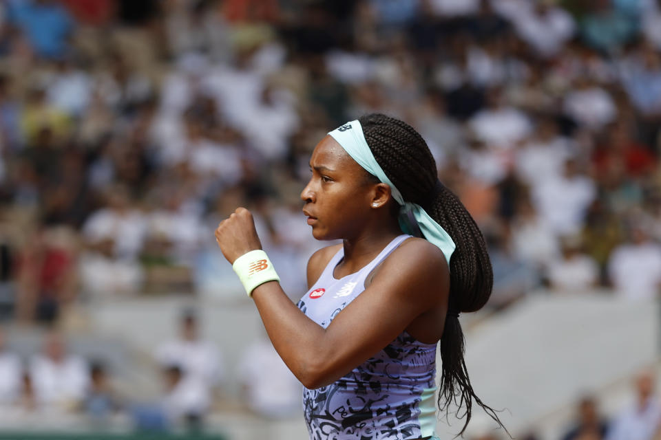 Coco Gauff of the U.S.celebrates scoring a point as she plays Italy's Martina Trevisan during their semifinal match of the French Open tennis tournament at the Roland Garros stadium Thursday, June 2, 2022 in Paris. (AP Photo/Jean-Francois Badias)