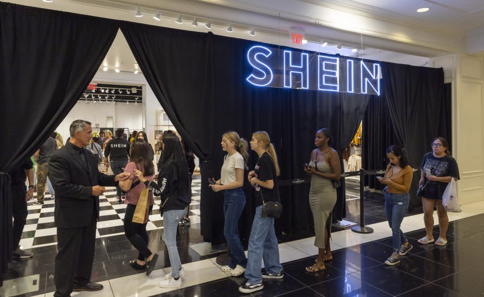 people queuing up outside a Shein store