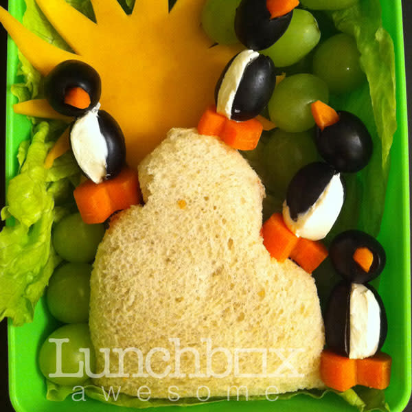 Heather kept the lunches together using a fairly shallow container and fillers like lettuce to help raise the sandwiches as seen here in the penguin box.<br><br>Photo: Heather Sitarzewski