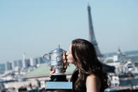 Czech Republic's Barbora Krejcikova kisses the French Open tennis tournament women's winner cup during a photocell Monday, June 14, 2021 in Paris. French Open champion Barbora Krejcikova completed a rare sweep of titles at Roland Garros as she won a third women's doubles major trophy with fellow Czech teammate Katerina Siniakova on Sunday. (AP Photo/Thibault Camus)