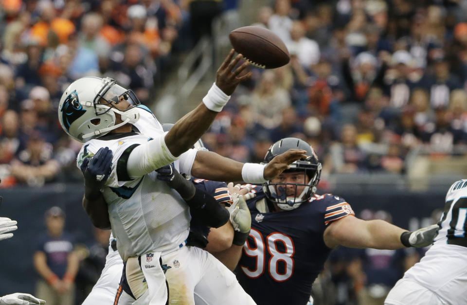 <p>Carolina Panthers quarterback Cam Newton throws the ball under pressure during the second half of an NFL football game against the Chicago Bears, Sunday, Oct. 22, 2017, in Chicago. (AP Photo/Nam Y. Huh) </p>