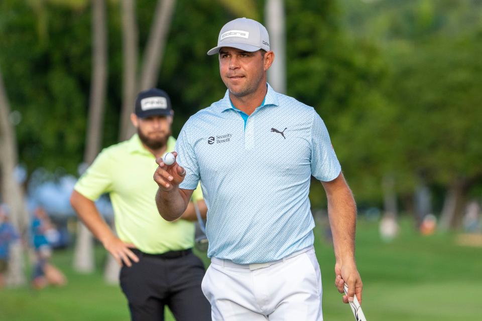 Gary Woodland, seen here acknowledging the crowd at his first tournament back from brain surgery at the Sony Open in Hawaii, continued his comeback this week at The Players Championship.