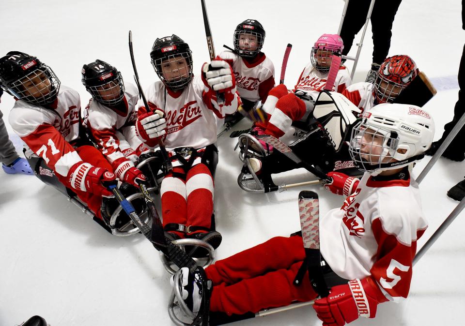 Conner Adcock, 9, (foreground) of Flat Rock leads the fire up chant before the second period of their novice game in the recent tournament Jan. 20, 2024 at Taylor Sportplex.