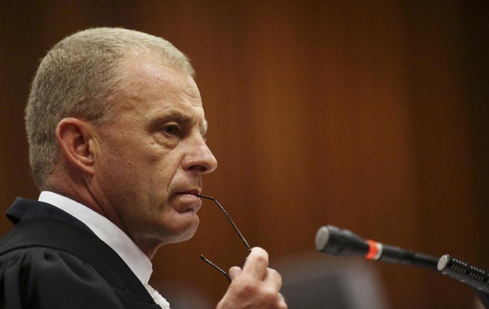 State prosecutor Gerrie Nel during cross questioning of Oscar Pistorius, in court in Pretoria, South Africa, Wednesday, April 9, 2014. Pistorius is charged with the murder of his girlfriend Reeva Steenkamp, on Valentines Day in 2013. (AP Photo/Siphiwe Sibeko, Pool)