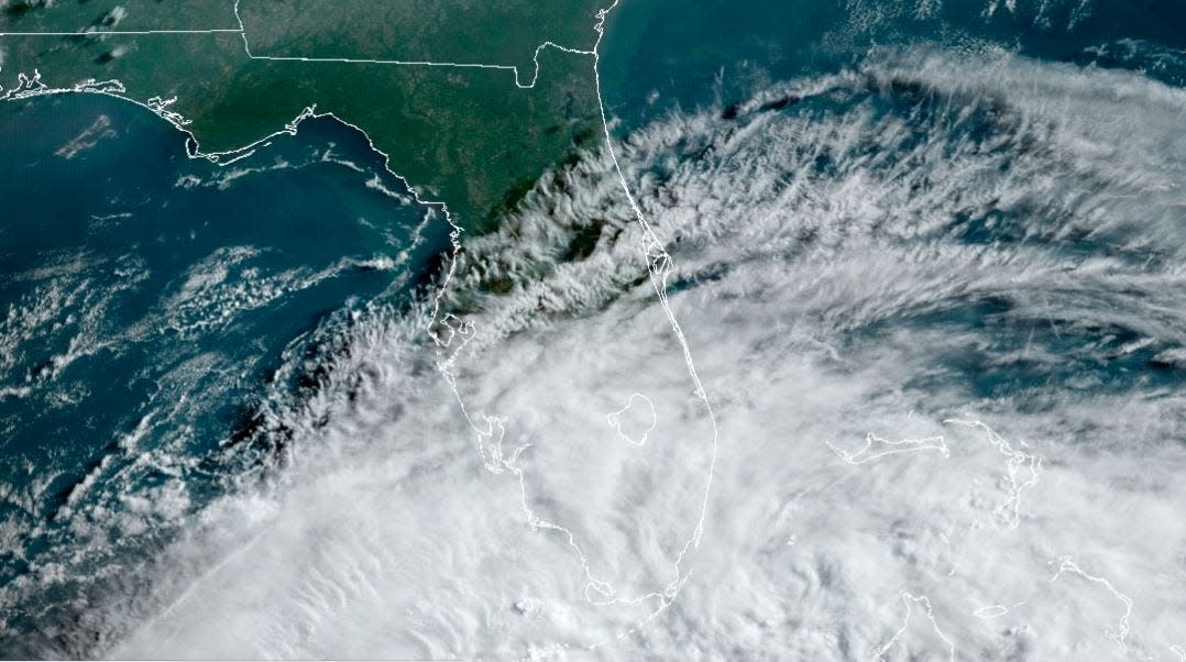 A National Oceanic and Atmospheric Administration satellite image from early Friday shows the fringes of the first organized tropical system of the 2022 Atlantic hurricane season washing over south Florida.