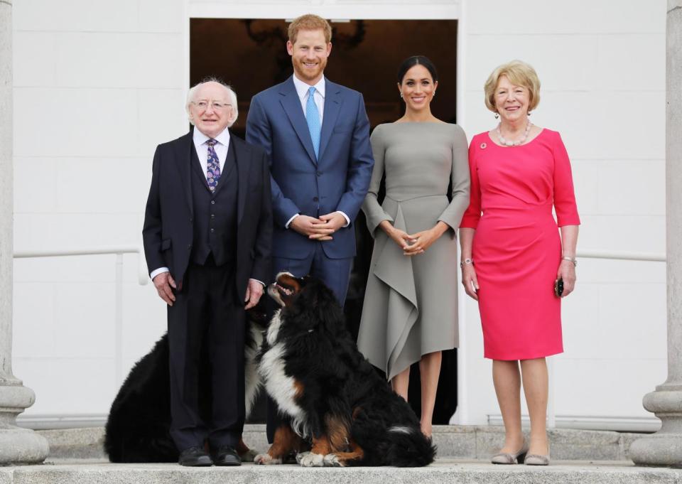 The Duke and Duchess of Sussex with President Michael D Higgins, his wife Sabina and their dogs Brod and Sioda at Aras an Uachtarain on the second day of their visit to Dublin (PA)