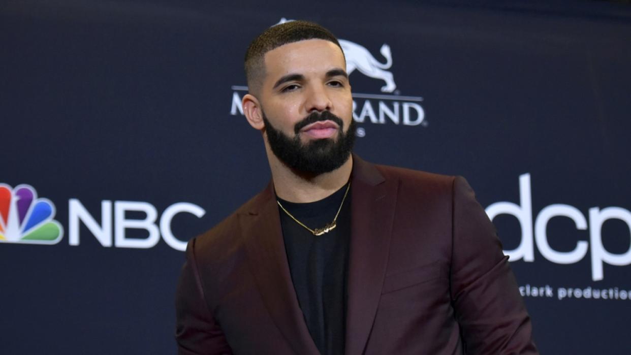 Drake poses for a photograph at the Billboard Music Awards.