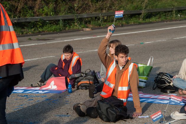 <strong>Protestors from Insulate Britain block the M25 motorway near Cobham in Surrey.</strong> (Photo: Guy Smallman via Getty Images)