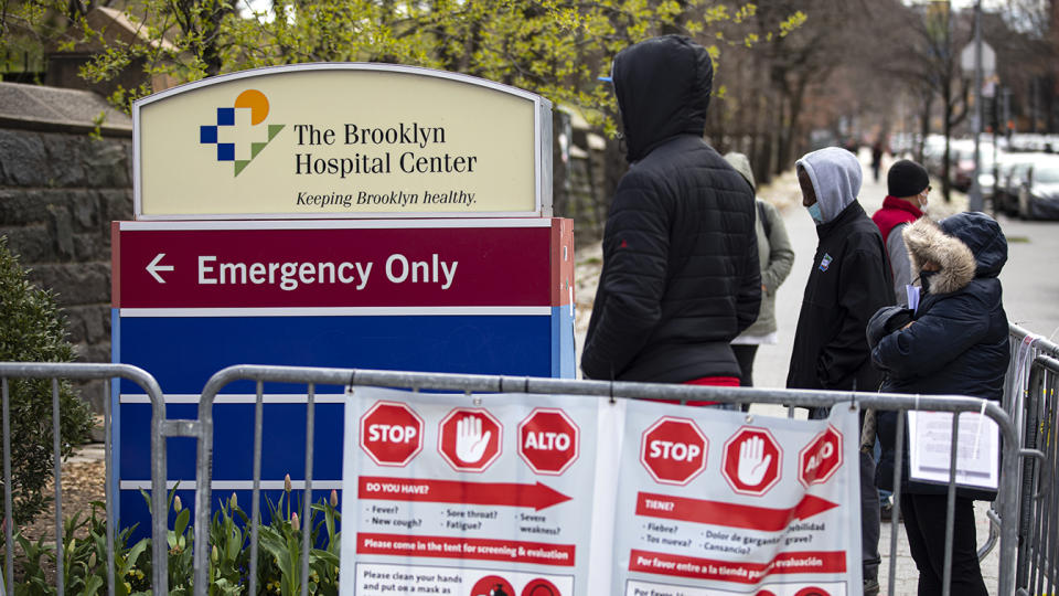 Local residents line up to be checked for possible effects of the coronavirus at a special tent in front of the Brooklyn Hospital Centers Emergency Room in Brooklyn, New York on April 2, 2020. (Robert Nickelsberg/Getty Images)