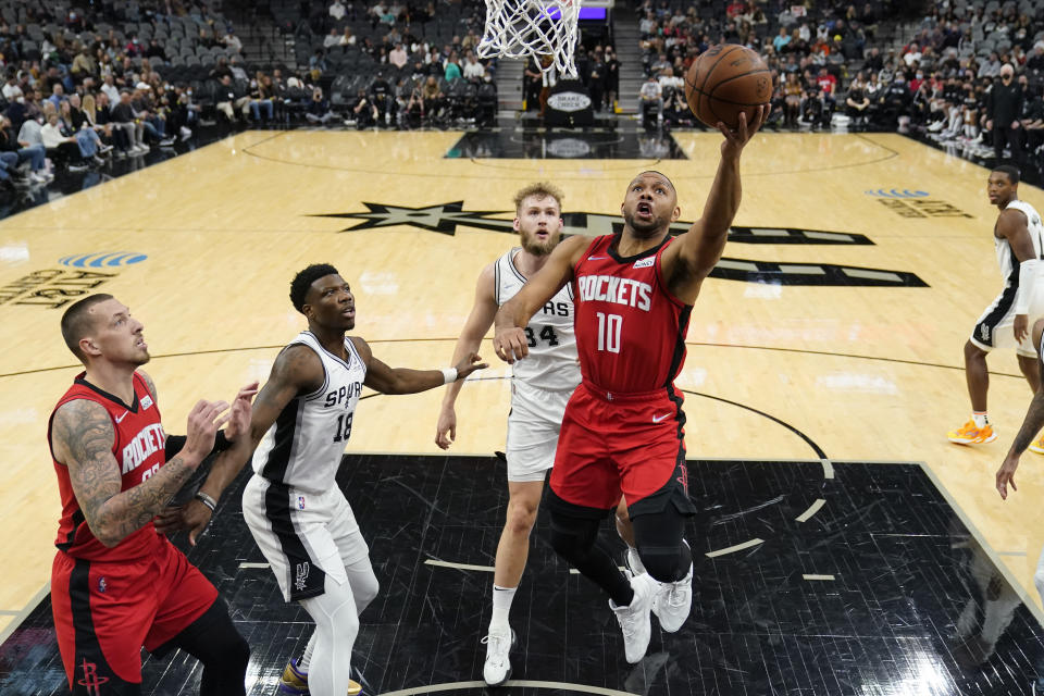 Houston Rockets guard Eric Gordon (10) drives to the basket against the San Antonio Spurs during the first half of an NBA basketball game, Wednesday, Jan. 12, 2022, in San Antonio. (AP Photo/Eric Gay)