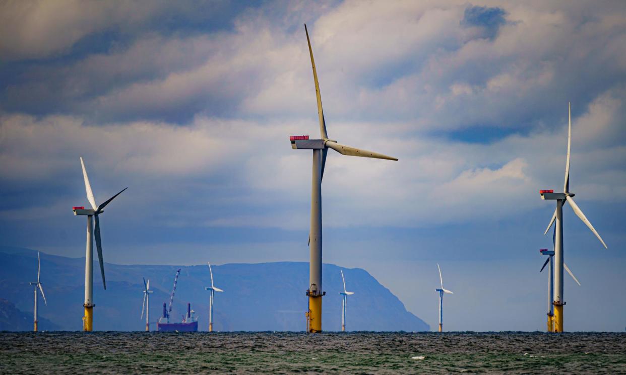 <span>At the time of the record fossil fuel low, wind accounted for about half of electricity generated while solar accounted for about 30%. </span><span>Photograph: Ben Birchall/PA</span>