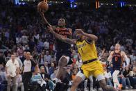 New York Knicks' OG Anunoby (8) drives past Indiana Pacers' Obi Toppin (1) during the second half of Game 2 in an NBA basketball second-round playoff series Wednesday, May 8, 2024, in New York. The Knicks won 130-121. (AP Photo/Frank Franklin II)