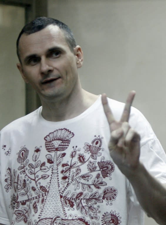 Ukrainian film director Oleg Sentsov listens to the verdict from a defendants' cage at a military court in the southern city of Rostov-on-Don, Russia, on August 25, 2015