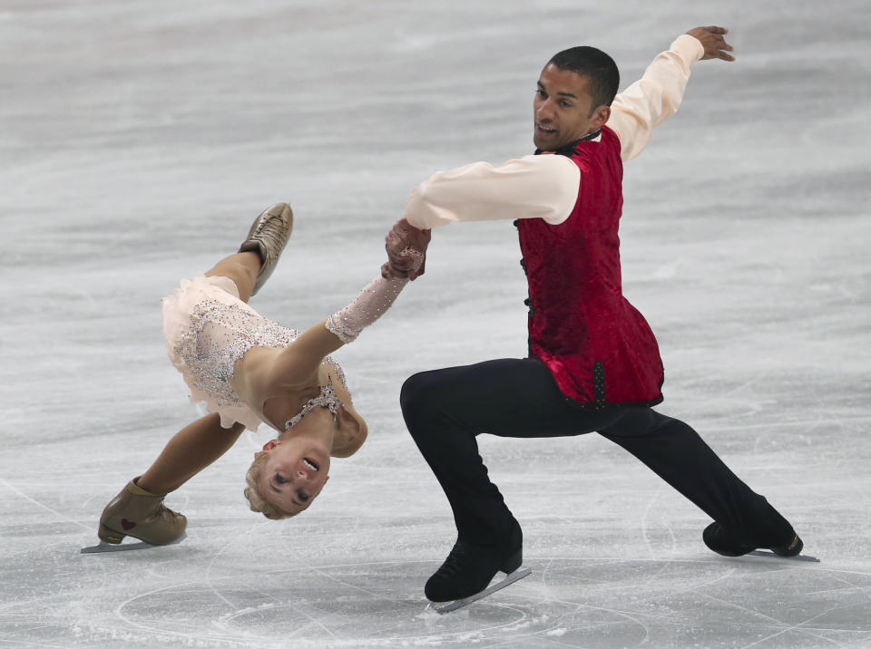 Aliona Savchenko and Robin Szolkowy of Germany perform during the pairs free skating in the World Figure Skating Championships in Saitama, near Tokyo, Thursday, March 27, 2014. The German pair wont the gold medal. (AP Photo/Koji Sasahara)