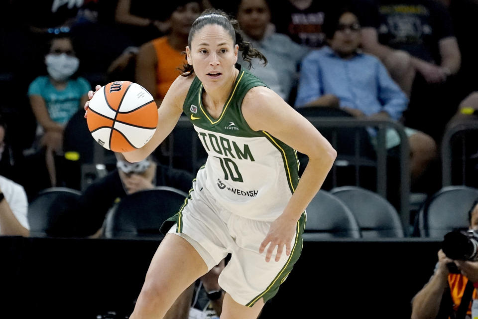 FILE - Seattle Storm guard Sue Bird (10) brings the ball upcourt during the first half of the Commissioner's Cup WNBA basketball game against the Connecticut Sun on Aug. 12, 2021, in Phoenix. The WNBA will begin its 26th season this weekend with many fascinating storylines including the potential retirement of Sue Bird and Sylvia Fowles, the return of Becky Hammon as a coach and the absence of Brittney Griner. (AP Photo/Matt York, File)