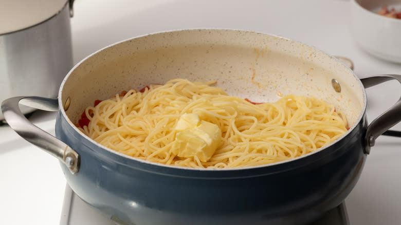 spaghetti and butter in pan