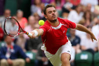 LONDON, ENGLAND - JULY 29: Stanislas Wawrinka of Switzerland plays a forehand during the Men's Singles Tennis match against Andy Murray of Great Britain on Day 2 of the London 2012 Olympic Games at the All England Lawn Tennis and Croquet Club in Wimbledon on July 29, 2012 in London, England. (Photo by Clive Brunskill/Getty Images)