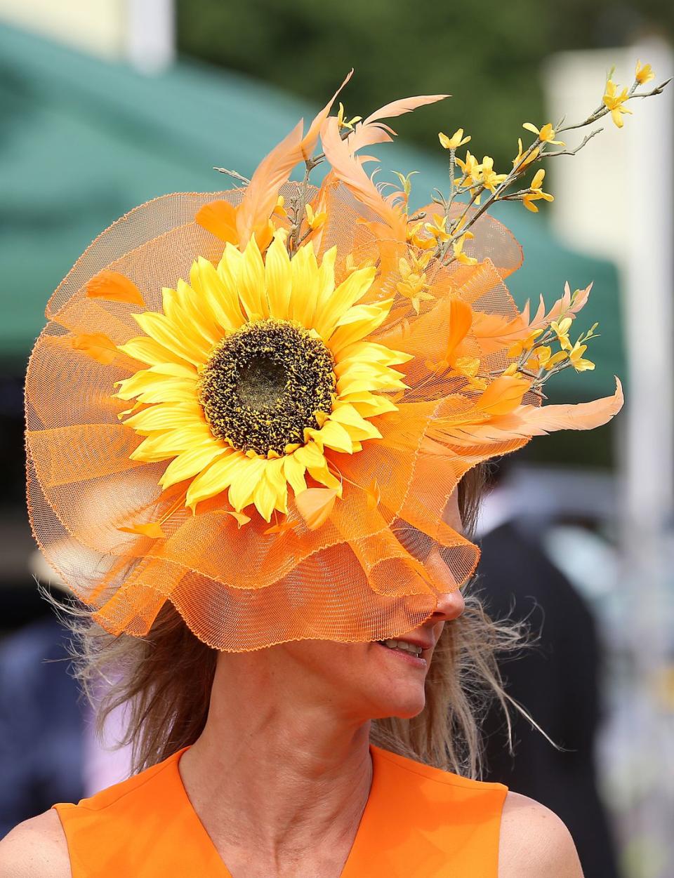 <p>One race goer wore a bright sunflower headpiece. </p>