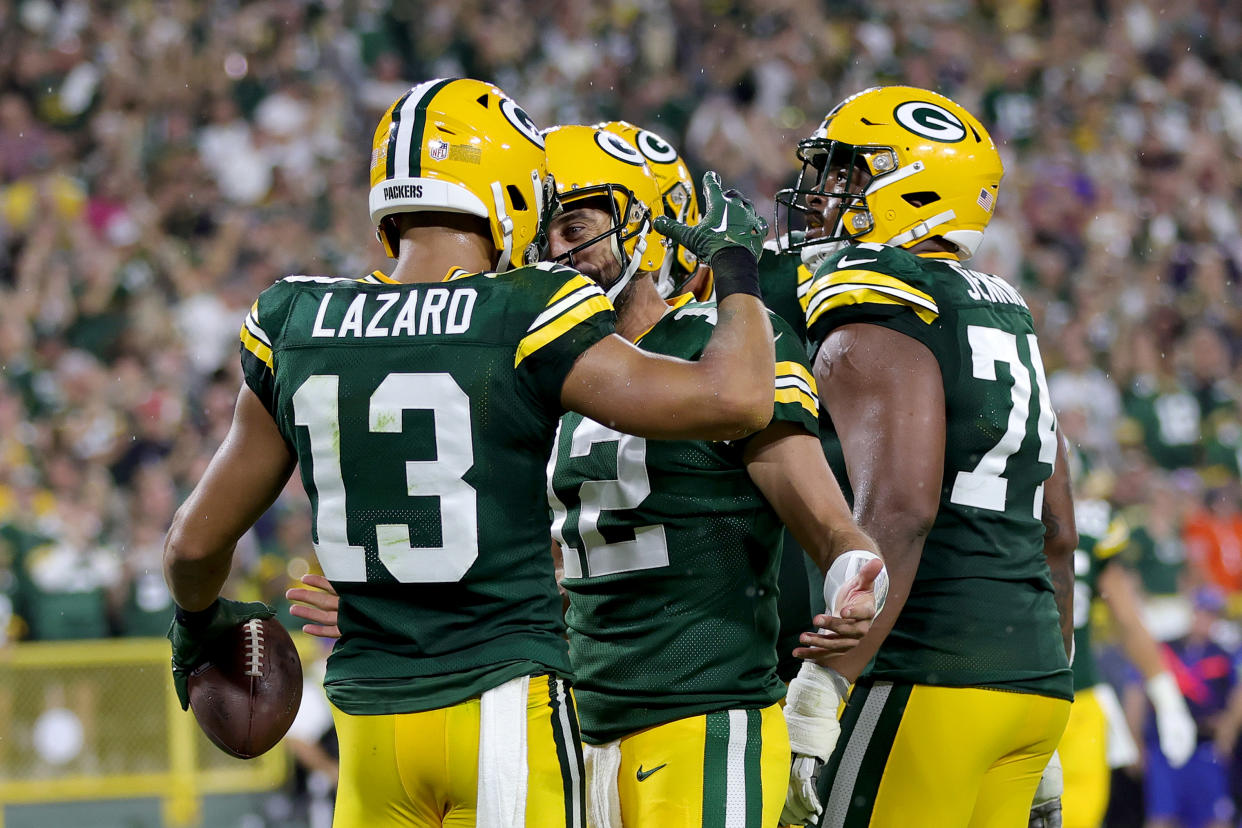 GREEN BAY, WISCONSIN - SEPTEMBER 18: Allen Lazard #13 of the Green Bay Packers celebrates a touchdown with Aaron Rodgers #12 during the first half in the game against the Chicago Bears at Lambeau Field on September 18, 2022 in Green Bay, Wisconsin. (Photo by Stacy Revere/Getty Images)