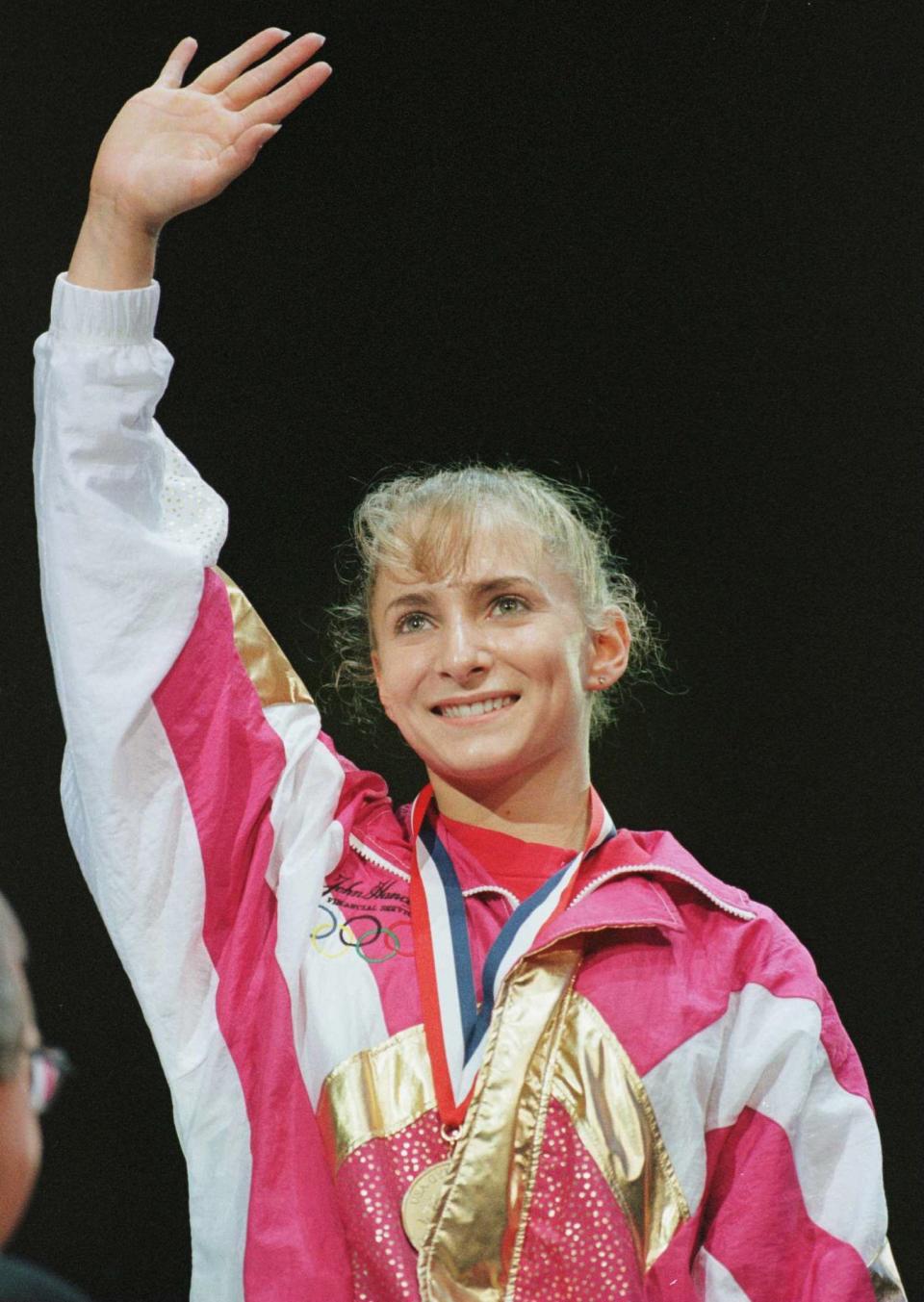 7 Jun 1996:  Shannon Miller waves from the podium after receiving the gold medal in the All-Around competition at the USA Gymnastics National Championships at the Thompson-Boling Arena, on the campus of the University of Tennessee in Knoxville. Mandatory