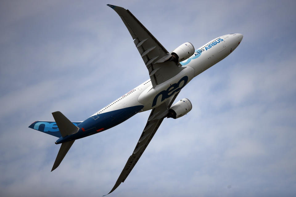 FILE - In this June 18, 2019 file photo, an Airbus A330 performs a demonstration flight at Paris Air Show, in Le Bourget, north east of Paris. European plane maker Airbus lost 1.1 billion euros ($1.3 billion) amid an unprecedented global slump in air travel because of the pandemic, but expects to deliver hundreds of planes and make a profit this year. (AP Photo/ Francois Mori, File)
