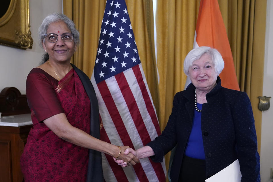 FILE - Treasury Secretary Janet Yellen, right, shakes hands with India's Finance Minister Nirmala Sitharaman, left, at the Treasury Department in Washington, Tuesday, April 11, 2023. (AP Photo/Susan Walsh, File)