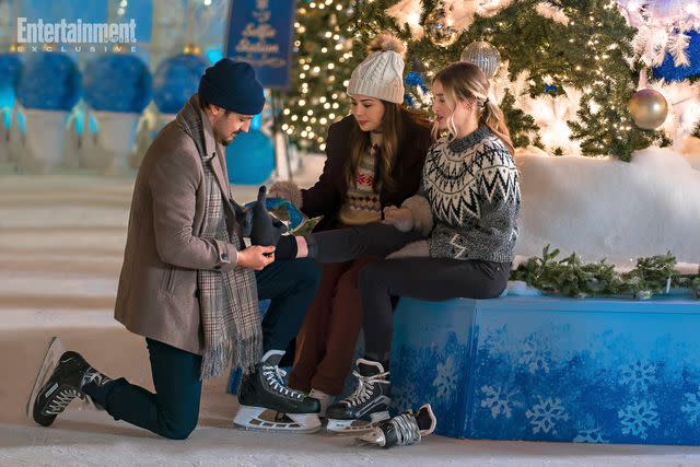 2023 Hallmark Media/Photographer: Steven Ackerman Tyler Hynes, Janel Parrish, Pascal Lamothe-Kipnes in 'Never Been Chris'd'