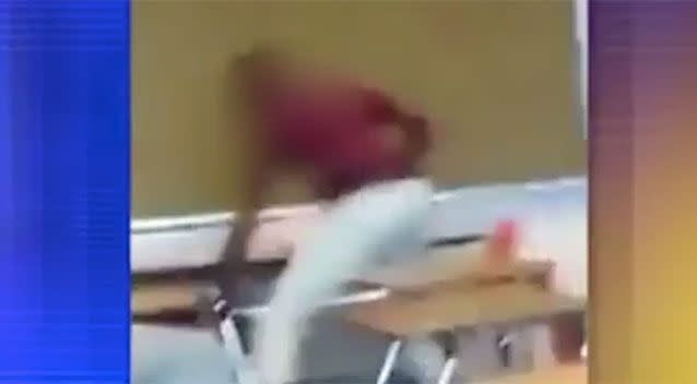 The student appears to continue swinging at the teacher once he is on the ground. Source: Fox 6