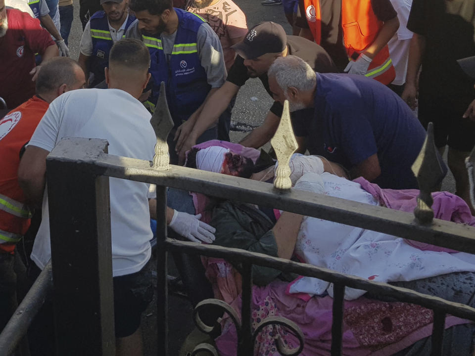 Civil Defense first-responders carry a man who was wounded after his handheld pager exploded, in the southern port city of Sidon, Lebanon, Tuesday, Sept. 17, 2024.(AP Photo)