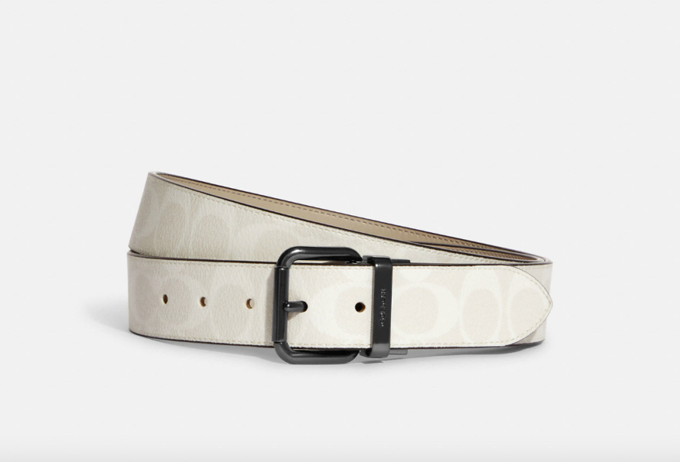 Coach Outlet Roller Buckle Cut To Size Reversible Belt 38 mm in Gunmetal/Chalk/Bone (Photo via Coach Outlet)