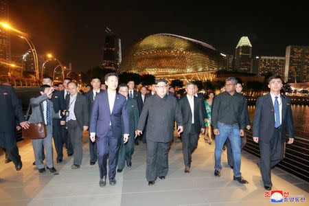 North Korea's leader Kim Jong Un, accompanied by Singapore's Foreign Minister Vivian Balakrishnan, visits Singapore in this picture released on June 11, 2018 by North Korea's Korean Central News Agency. KCNA via REUTERS