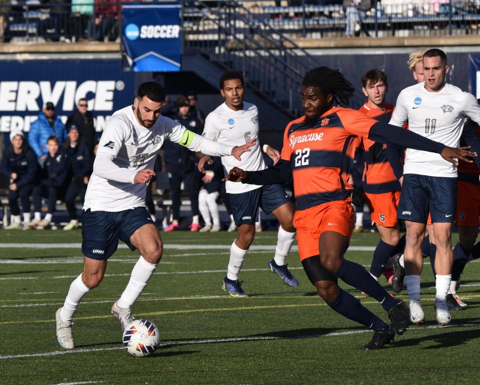 University of New Hampshire men's soccer captain Eli Goldman brings the ball up the field during Sunday's NCAA second-round game against Syracuse. The Wildcats will host No. 9 Clemson on Sunday in a third-round game at 5 p.m.