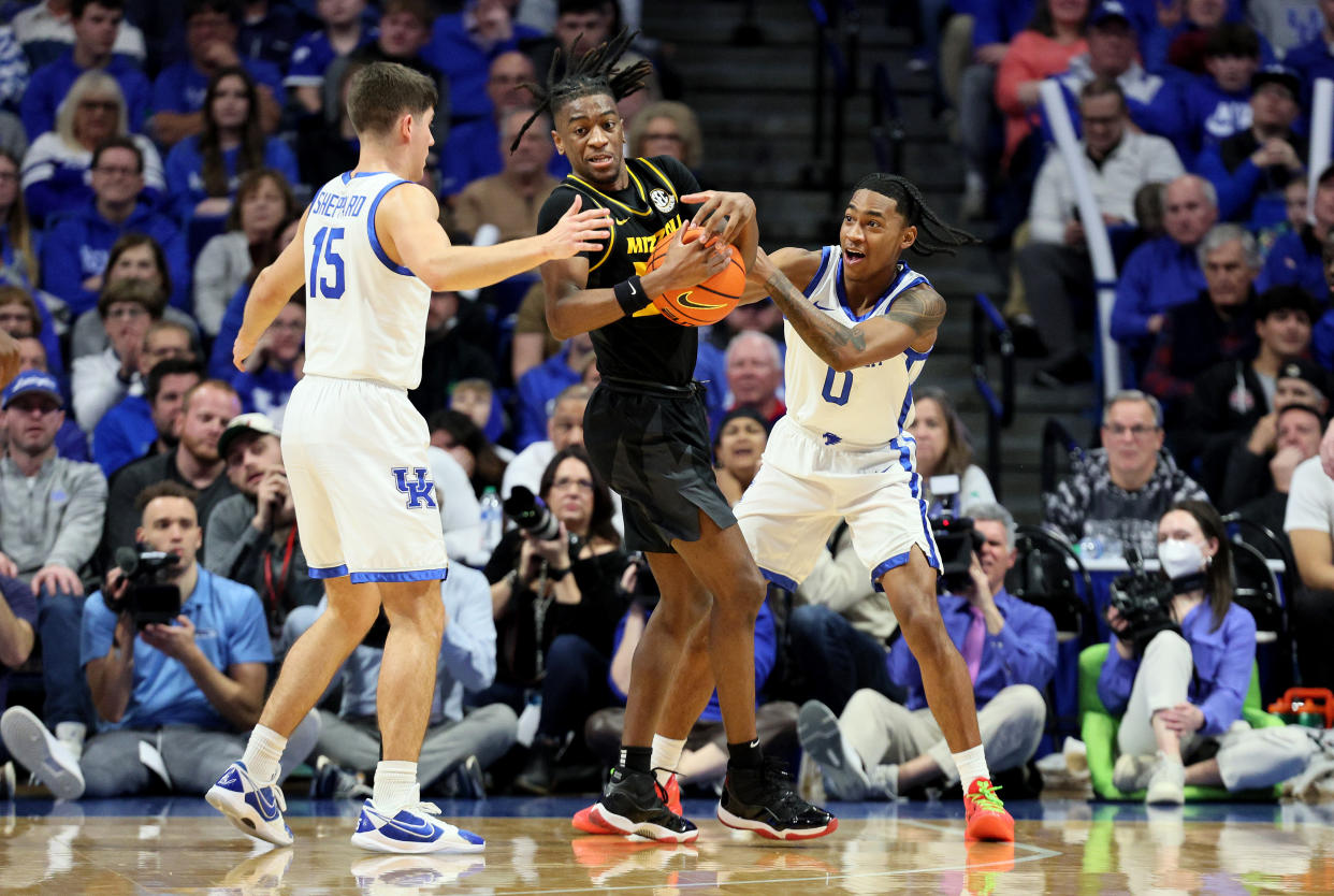 LEXINGTON, KENTUCKY - JANUARY 09: Reed Sheppard #15 and Rob Dillingham #0 of the Kentucky Wildcats defend Sean East II #55 of the Missouri Tigers in the second half at Rupp Arena on January 09, 2024 in Lexington, Kentucky. (Photo by Andy Lyons/Getty Images)