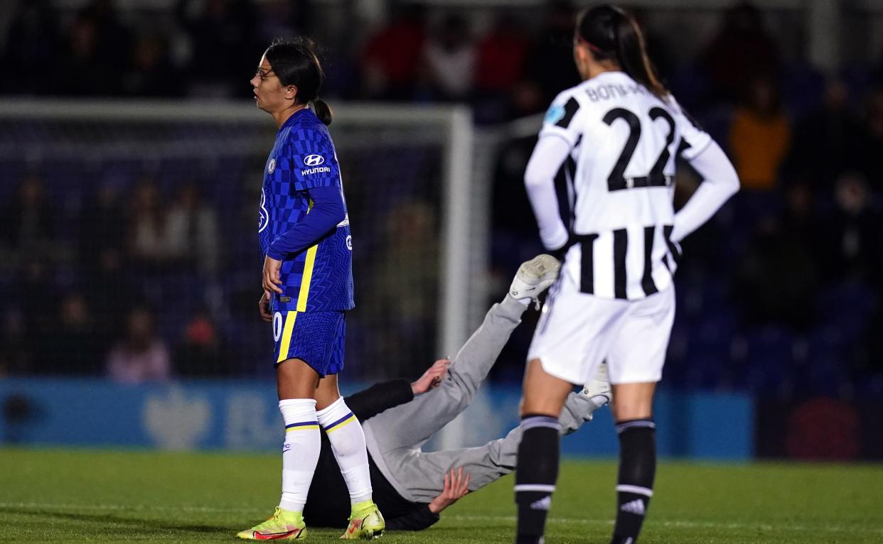 A pitch invader is grounded courtesy of Chelsea's Sam Kerr during the UEFA Women's Champions League, Group A match at Kingsmeadow, London. Picture date: Wednesday December 8, 2021. (Photo by John Walton/PA Images via Getty Images)
