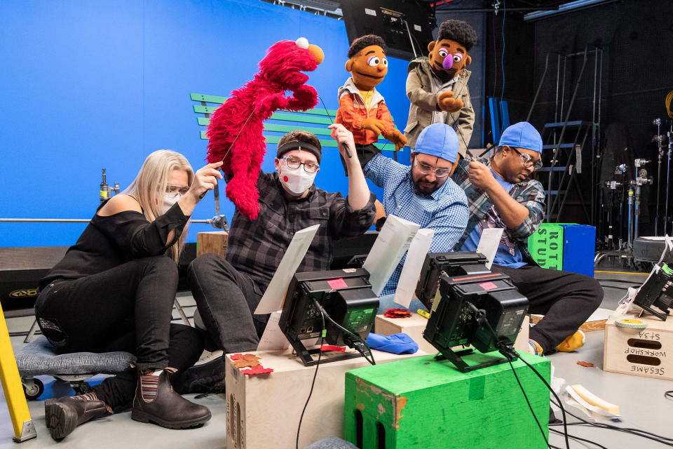 Puppeteers Carmen Osbahr (assisting for Elmo, she plays Rosita), Ryan Dillon (Elmo), Bradley Freeman Jr. (Wes) and Chris Thomas Hayes (Elijah) on setZach Hyman—Sesame Workshop