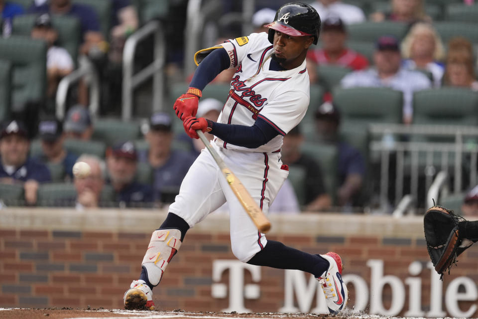 Atlanta Braves' Ozzie Albies drives in a run with a triple in the first inning of a baseball game against the Detroit Tigers Tuesday, June 18, 2024, in Atlanta. (AP Photo/John Bazemore)